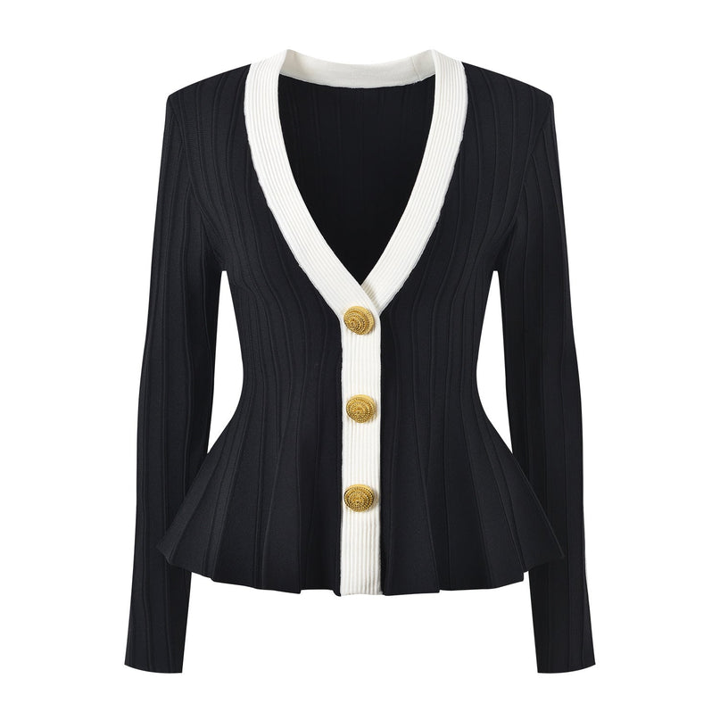 Black and white peplum style top with gold button embellishments