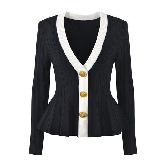Black and white peplum style top with gold button embellishments