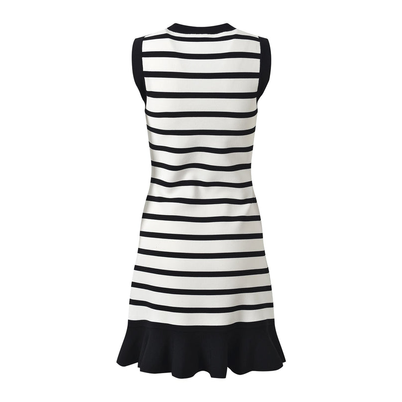 Black and white striped knit body-con dress with gold button accents on shoulders