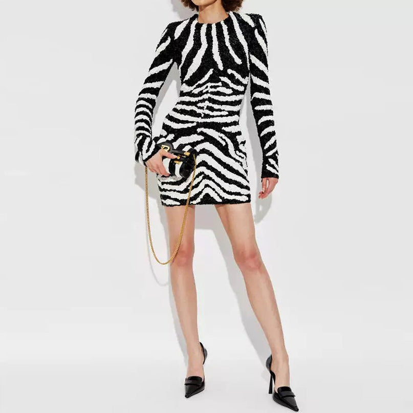 Black and white zebra stripe bodycon dress with long sleeves and high neckline