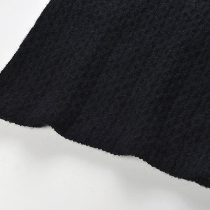 Sophia black ribbed knitted jacket with white accents and gold buttons paired with a matching bodycon skirt
