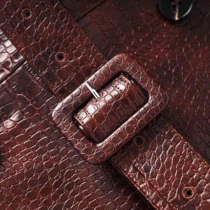 Blair wearing a rich dark brown croc-embossed faux leather trench coat with wide lapels and double-breasted button closure