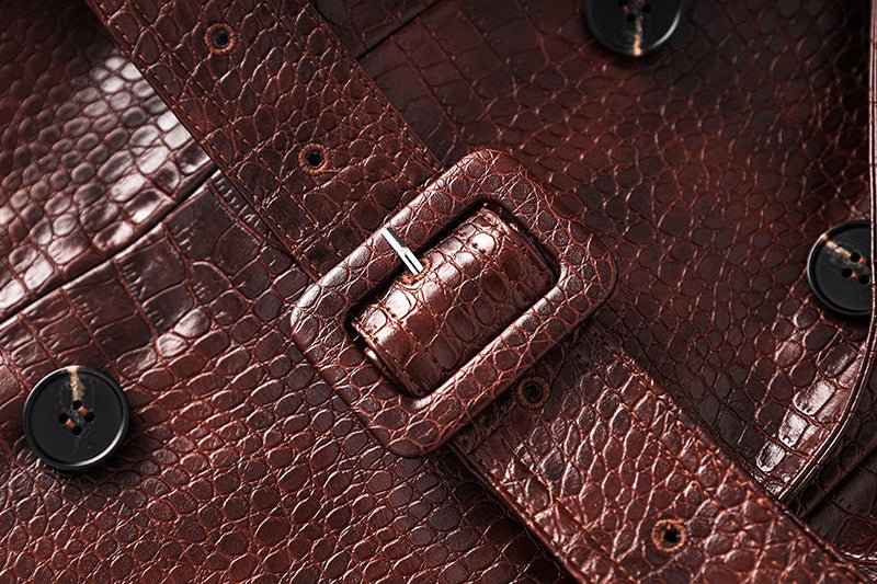 Blair wearing a rich dark brown croc-embossed faux leather trench coat with wide lapels and double-breasted button closure