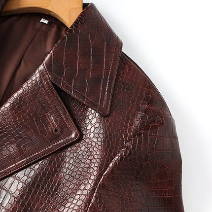 Blair Classic Long Trench Coat Croc-Embossed Texture Rich Dark Brown Glossy Finish Tailored Waist Adjustable Belt Wide Lapels Double-Breasted Button Closure Faux Leather Cuff Straps Storm Flap Bold Black Buttons Business Wear Evening Outings Luxury Street Style Sophistication Bold Elegance