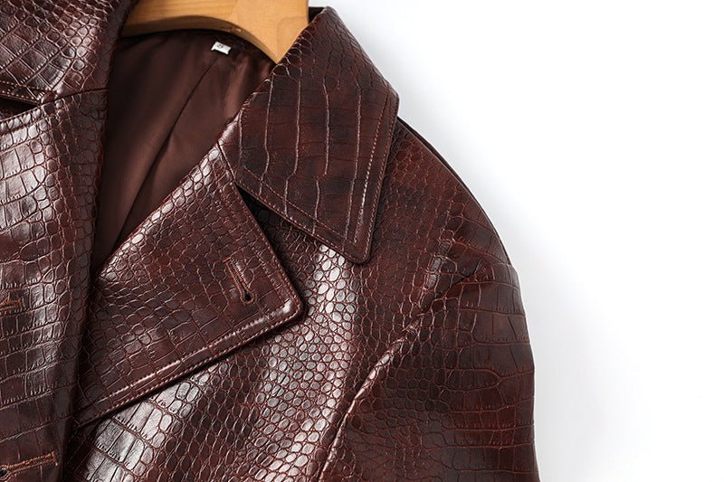Blair Classic Long Trench Coat Croc-Embossed Texture Rich Dark Brown Glossy Finish Tailored Waist Adjustable Belt Wide Lapels Double-Breasted Button Closure Faux Leather Cuff Straps Storm Flap Bold Black Buttons Business Wear Evening Outings Luxury Street Style Sophistication Bold Elegance