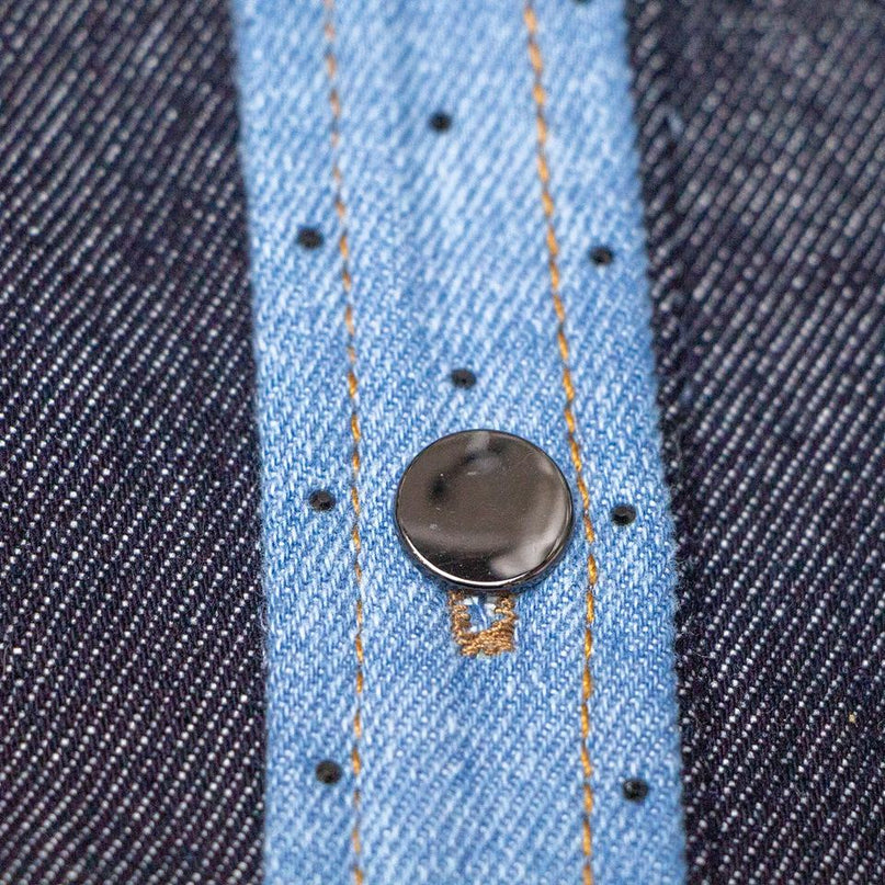 Blue denim jacket with contrast design and lapel collar worn by Emily