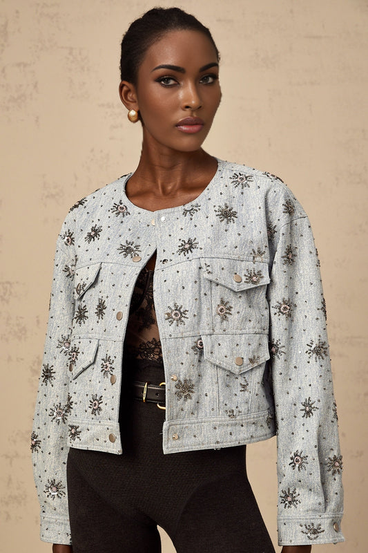 Blue denim jacket with studded sun design and Katell branding