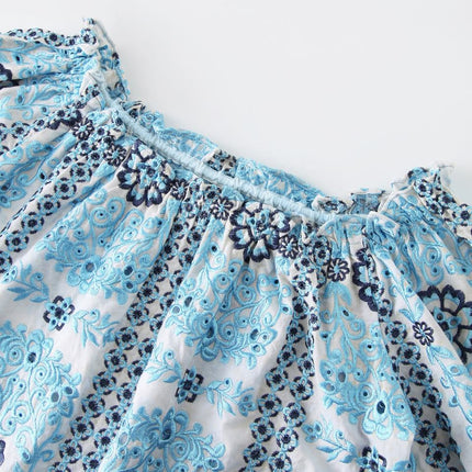 Sarah wearing Blue Embroidered Floral Blouse