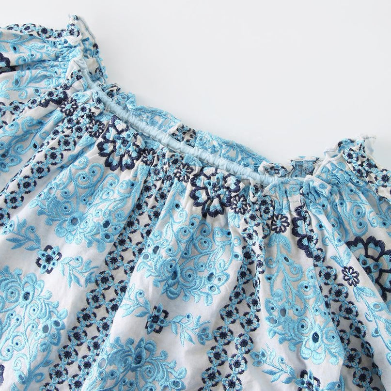 Sarah wearing Blue Embroidered Floral Blouse