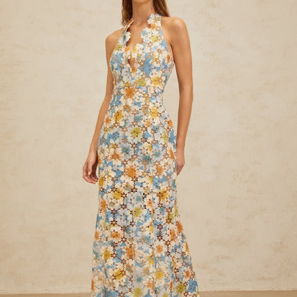 Blue halterneck sleeveless maxi dress with floral embroidery and cut-out design