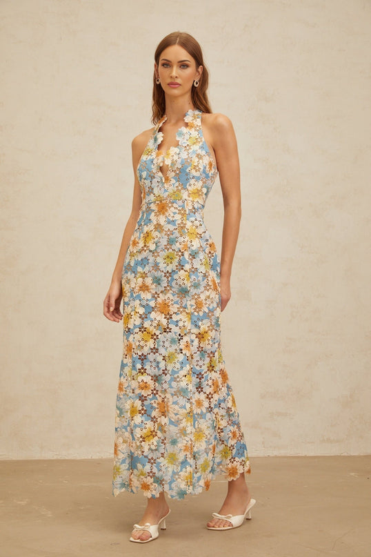 Blue halterneck sleeveless maxi dress with floral embroidery and cut-out design