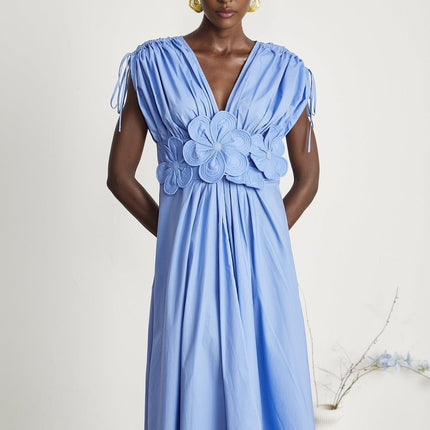 Blue floral maxi dress with petal details and drawstring waist