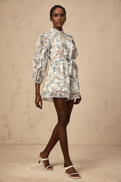Blue floral print jumpsuit with lace trim and ruffles called Eugenie