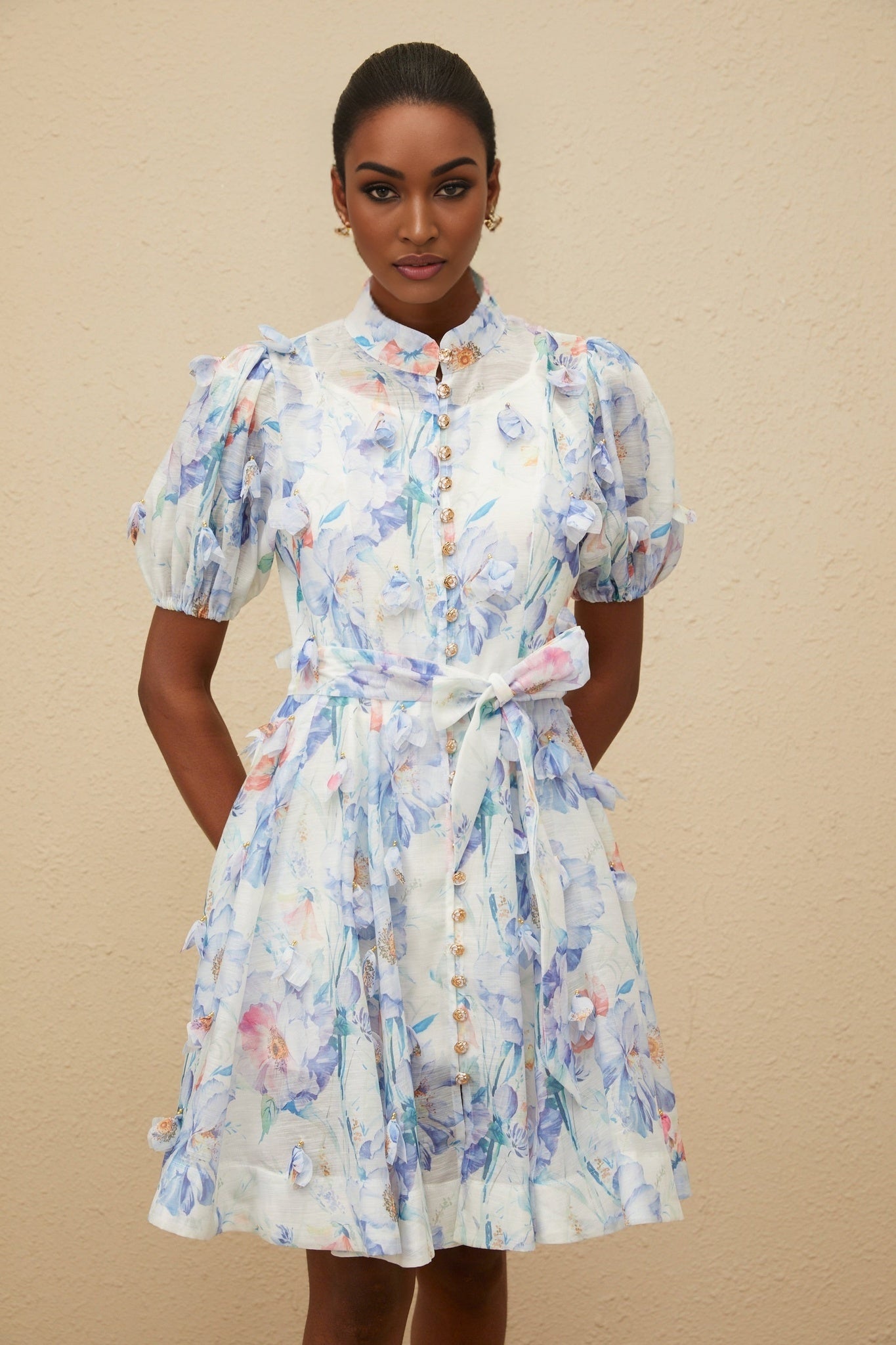 Blue floral print puff sleeve dress with decorative buttons and shirred effect