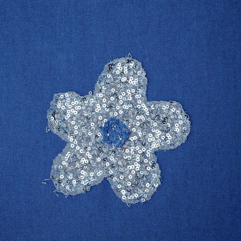 Jane wearing Blue Floral Woven Blouse with Pearl Buttons and Round Neckline