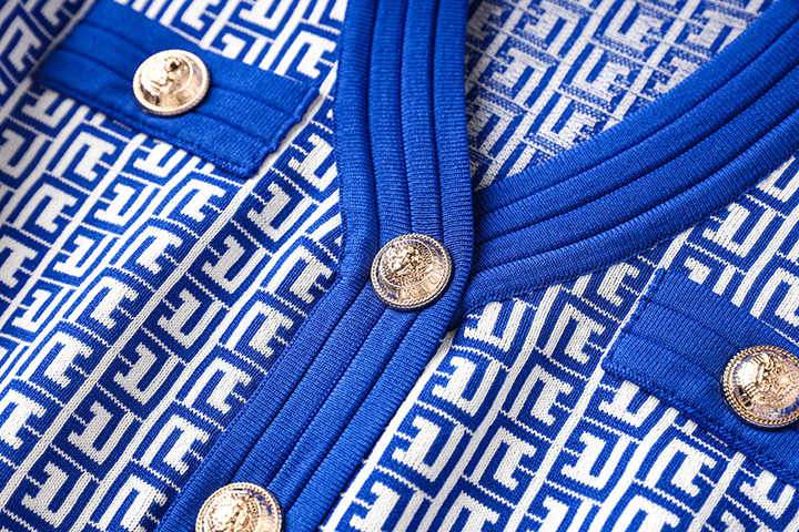 Blue geometric print A-line dress with gold-tone buttons and pockets