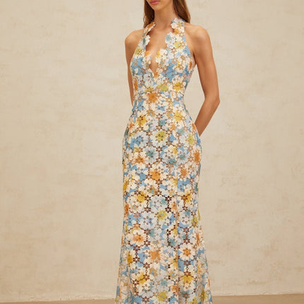 Blue halterneck sleeveless maxi dress with floral embroidery and cut-out design