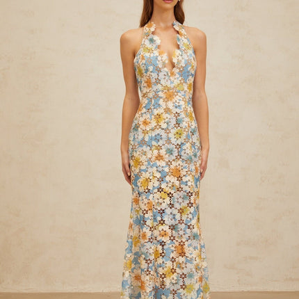 Blue halterneck sleeveless maxi dress with floral embroidery and cut-out design