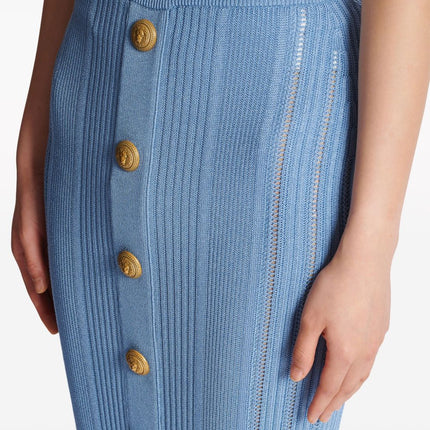 Blue high-waisted midi skirt with vertical ribbed texture and gold buttons