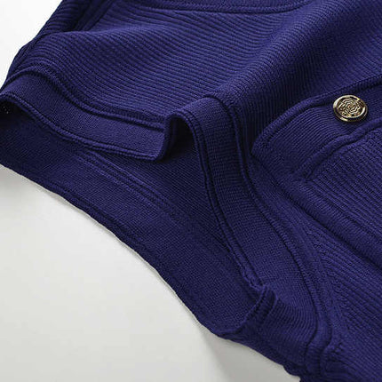 Blue knit pleated button-up top with tie-dye accents and decorative buttons