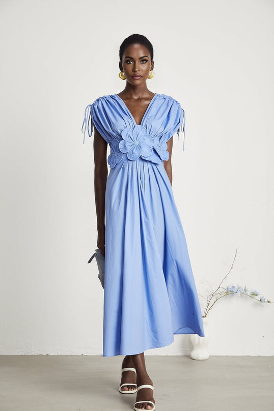 Blue maxi dress with floral petal detail and drawstring waist named Emma