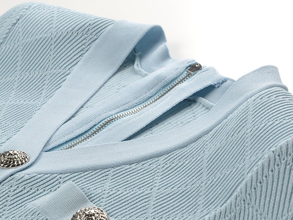 Blue ribbed knit button-front dress with metallic buttons and pocket accents