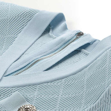 Blue ribbed knit button-front slim fit shirt with metallic buttons and pocket accents