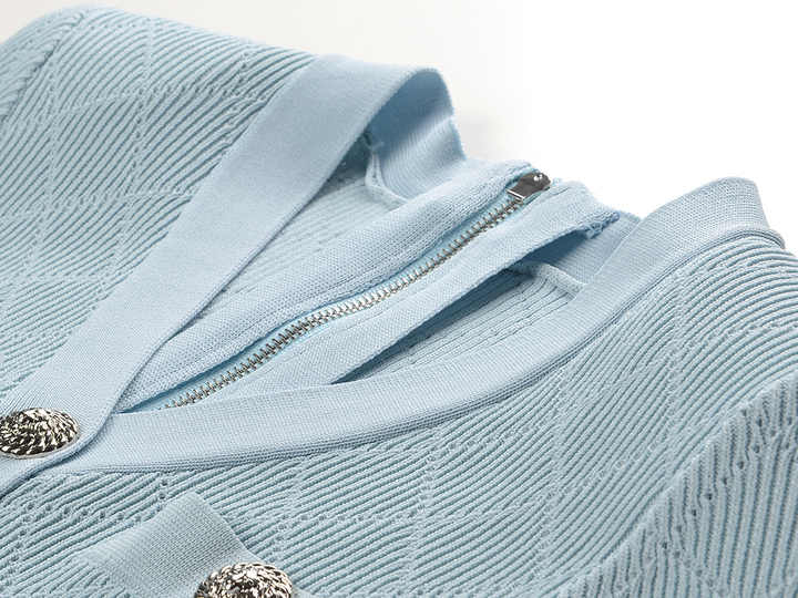 Blue ribbed knit button-front slim fit shirt with metallic buttons and pocket accents