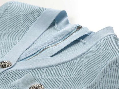 Blue ribbed knit button-front slim fit shirt with metallic buttons and pocket accents
