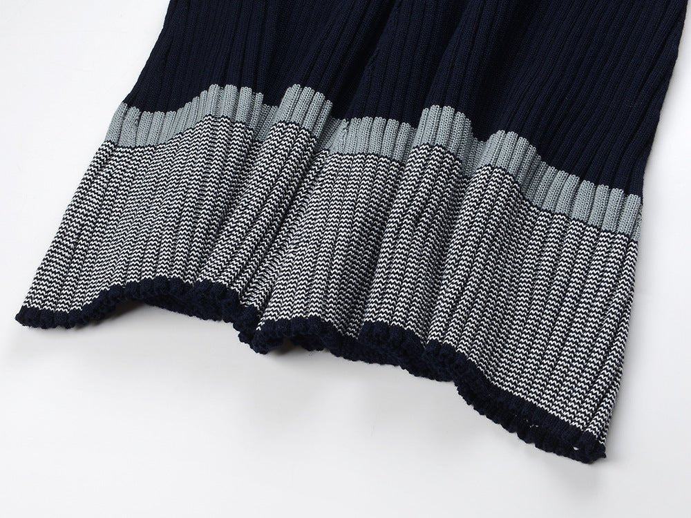 Blue ribbed knit dress with striped sleeves and skirt sections