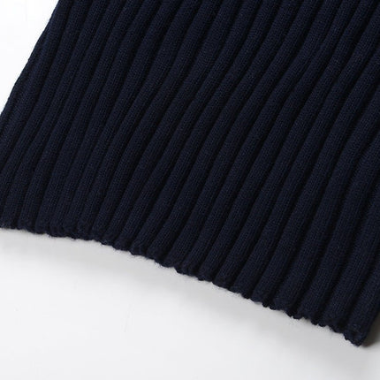 Blue ribbed knit dress with striped sleeves and skirt sections