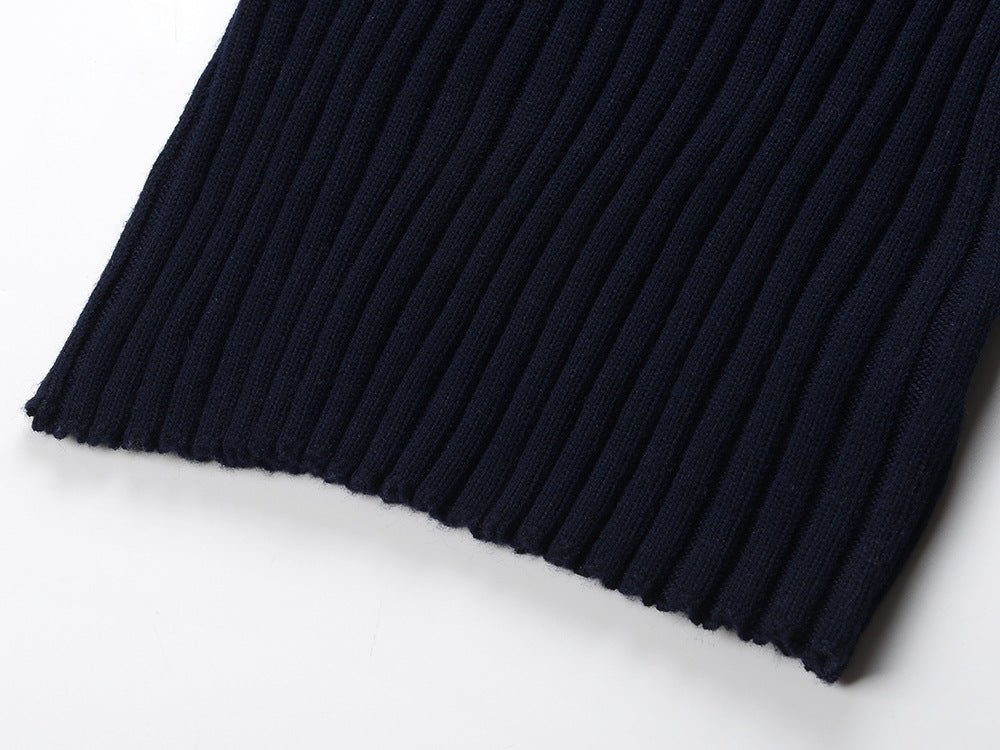 Blue ribbed knit dress with striped sleeves and skirt sections
