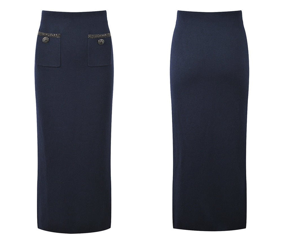 Blue tailored two-piece suit with decorative buttons and embellishments