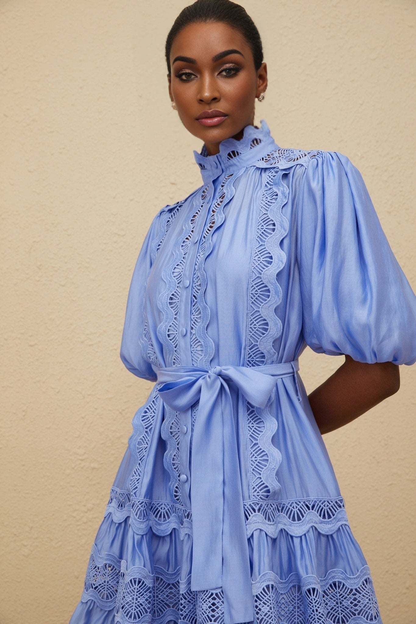 Blue tiered embroidered dress with puff sleeves and cut-out detailing