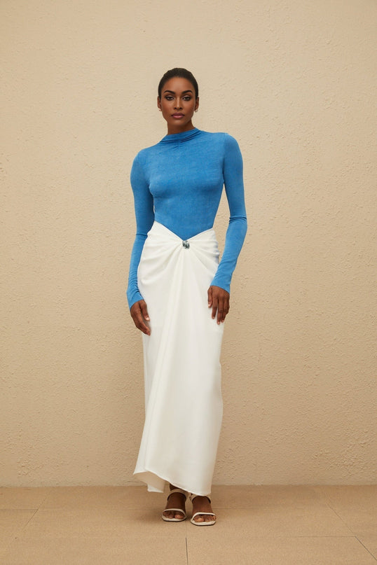 Blue turtleneck bodysuit with long sleeves and fitted silhouette