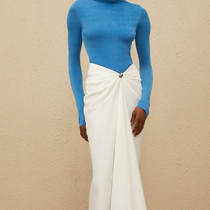 Blue turtleneck bodysuit with long sleeves and fitted silhouette