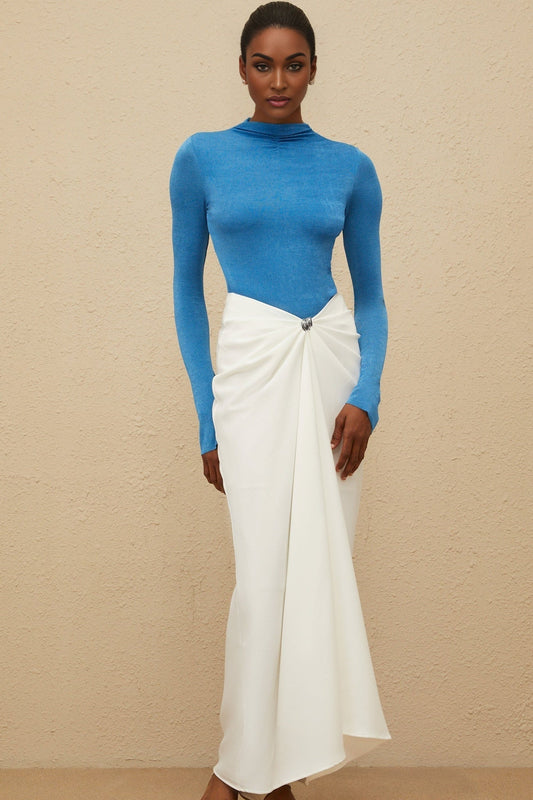 Blue turtleneck bodysuit with long sleeves and fitted silhouette