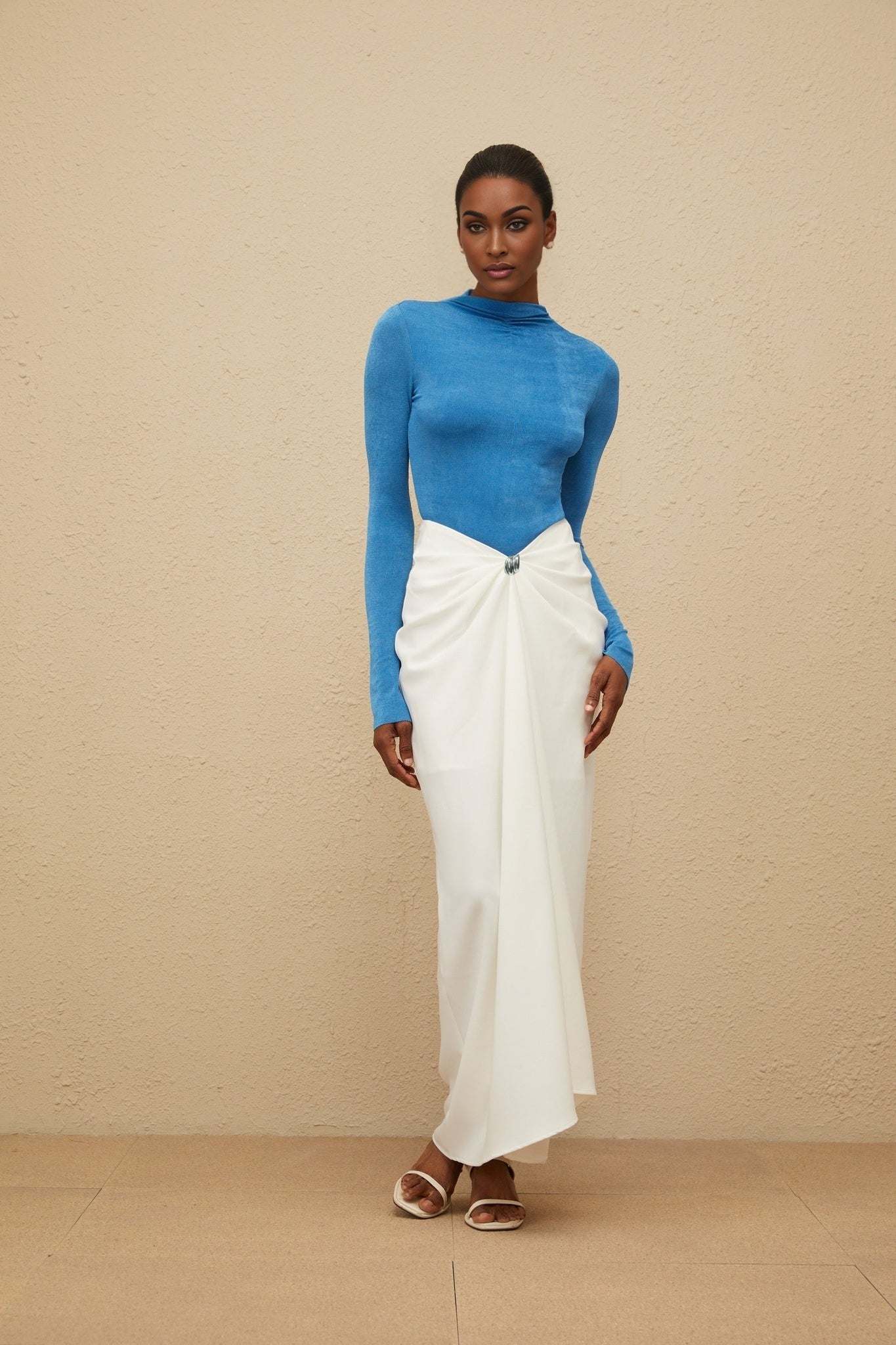 Blue turtleneck bodysuit with long sleeves and rear zip fastening made of 95% Terylene fiber and 5% Spandex