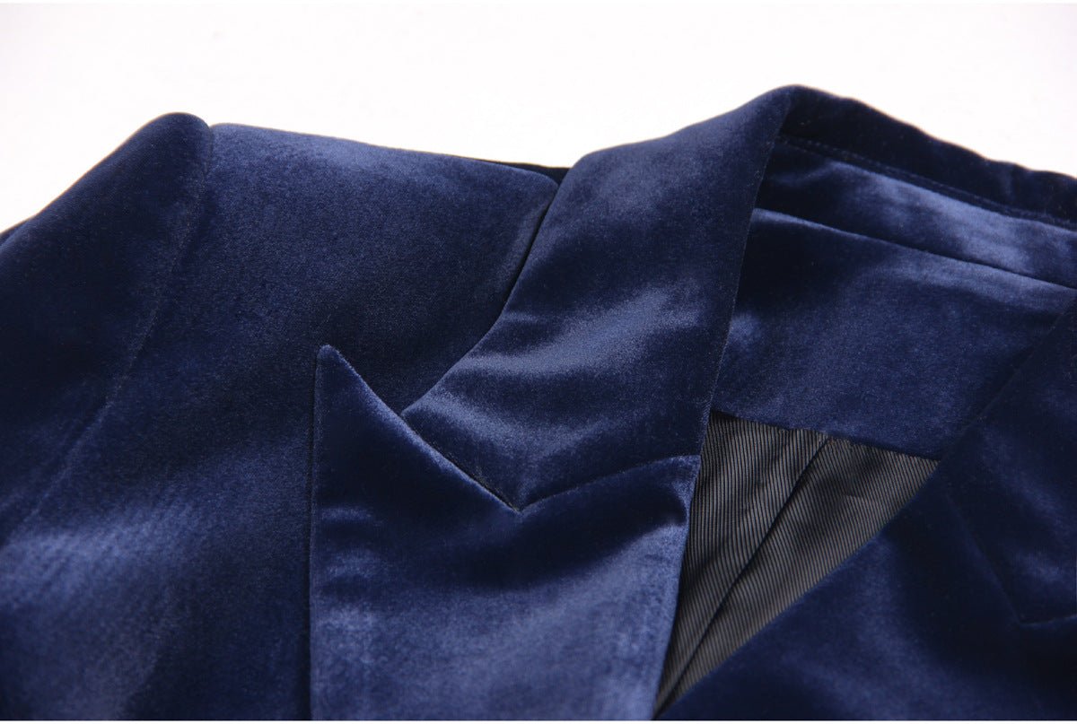 Blue velvet tailored power suit with gold-tone buttons