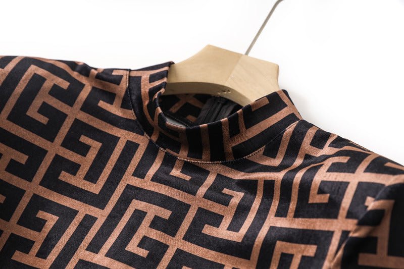 Brown geometric logo print form-fitting long sleeve top in black and warm beige tones