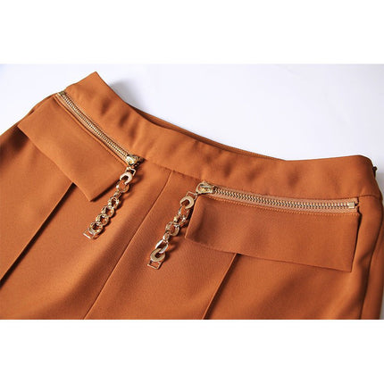 Brown high-waisted flared-leg pants with gold-tone chain embellishment