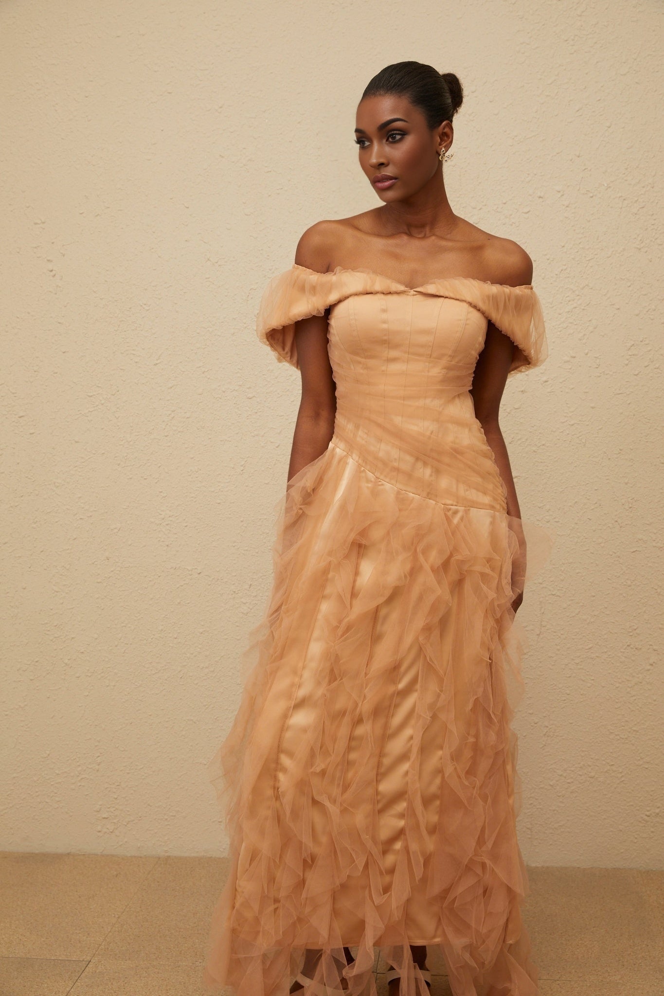 Brown off the shoulder strapless maxi dress with ruffled detailing and cinched waist