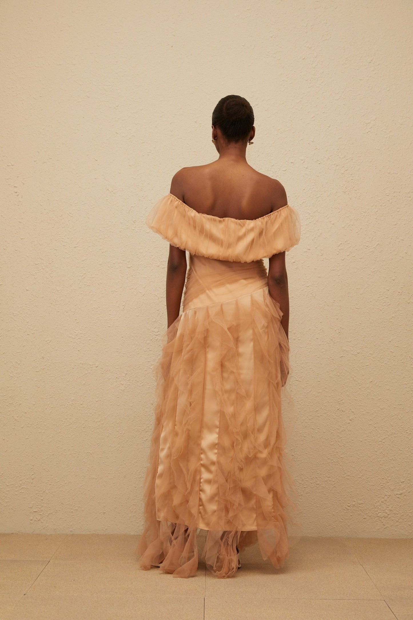 Brown off the shoulder strapless maxi dress with ruffled detailing and boned bodice