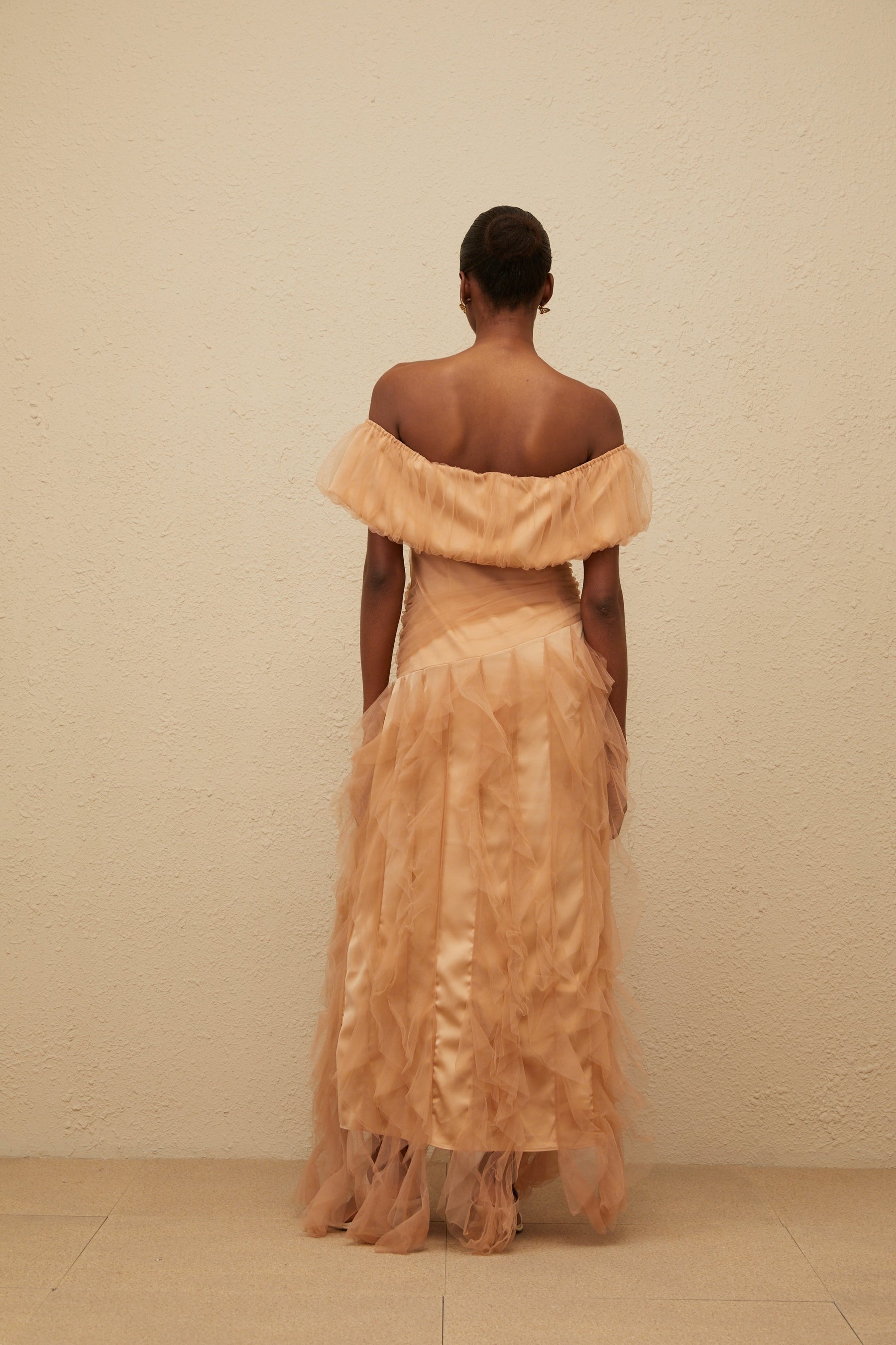 Brown off the shoulder strapless maxi dress with ruffled detailing and boned bodice