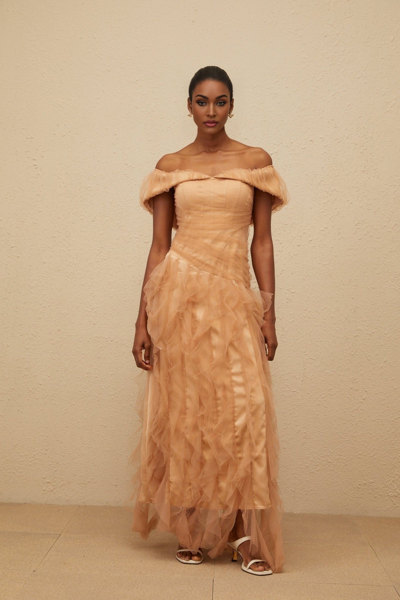 Brown off the shoulder strapless maxi dress with ruffled detailing and cinched waist