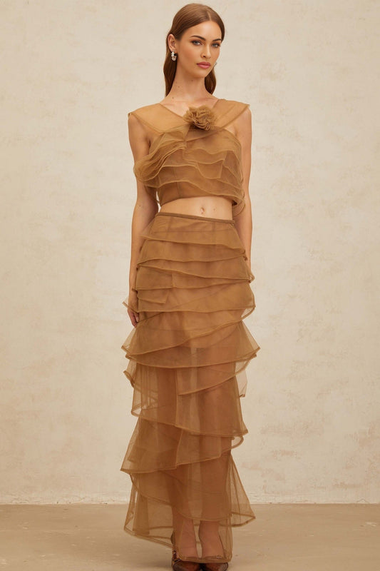 Brown sleeveless tulle layered cropped top with 3D-petal detailing and rear zip fastening, paired with high rise tulle layered maxi skirt with rear zip fastening