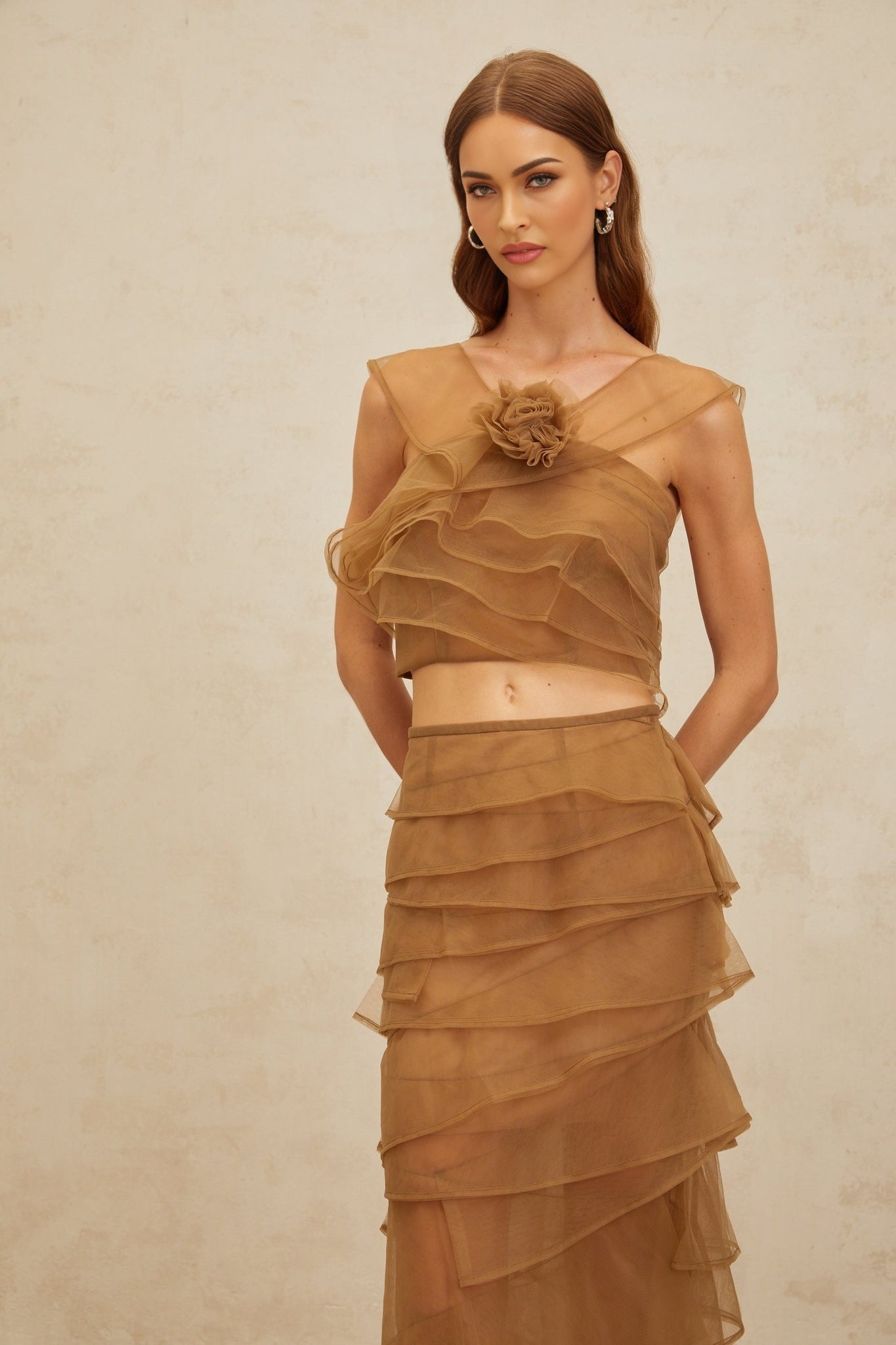 Brown Tulle Layered Sleeveless Crop Top with 3D Petal Detailing and Rear Zip Fastening, paired with High Rise Maxi Skirt in Brown Terylene Fiber Composition