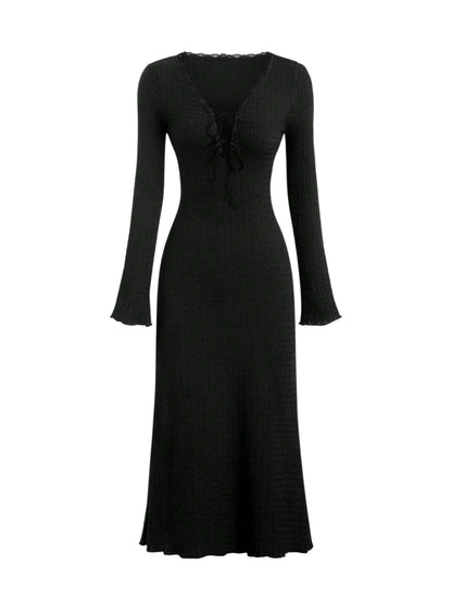 Black lace-up maxi dress with long sleeves and a flowing silhouette