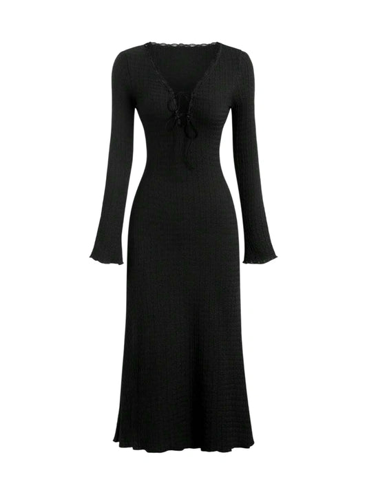 Black lace-up maxi dress with long sleeves and a flowing silhouette