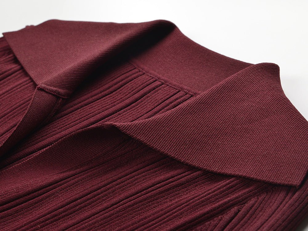 Burgundy fitted knit sweater with button details and flared sleeves